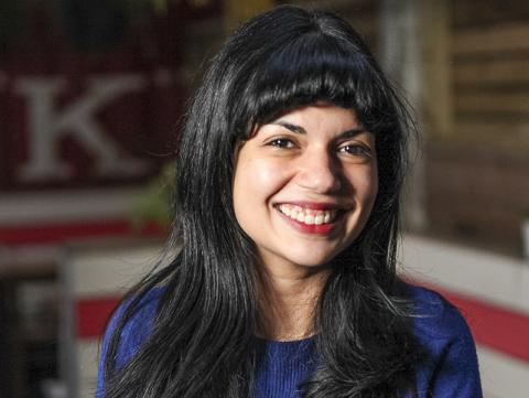 Melissa Fuster, smiling, red, white, black background