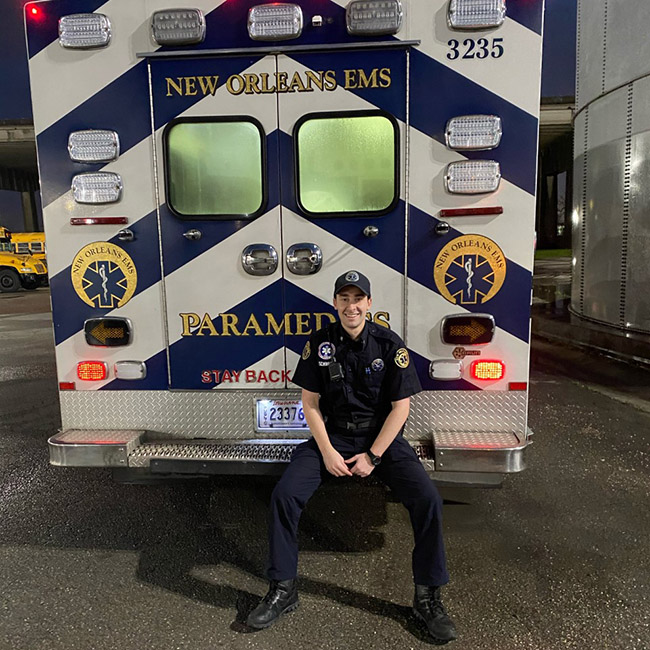 Photo of Alexander Schwartz in front of ambulance